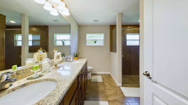 bathroom with an enclosed shower, toilet, and a wealth of natural light