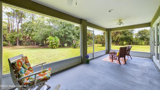 sunroom featuring ceiling fan