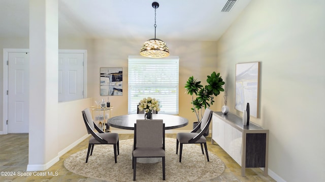 dining area featuring vaulted ceiling