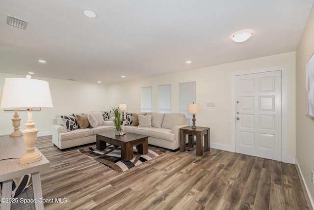 living room featuring dark wood-type flooring