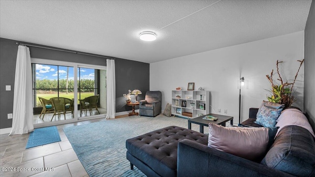 living room with tile patterned flooring and a textured ceiling