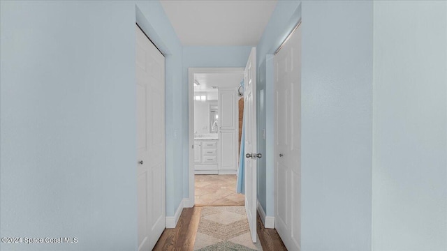 corridor featuring hardwood / wood-style flooring