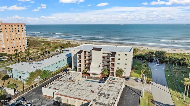 bird's eye view with a view of the beach and a water view