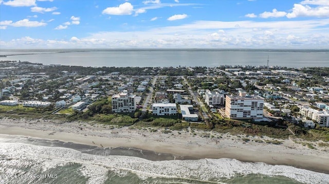 aerial view featuring a water view and a beach view