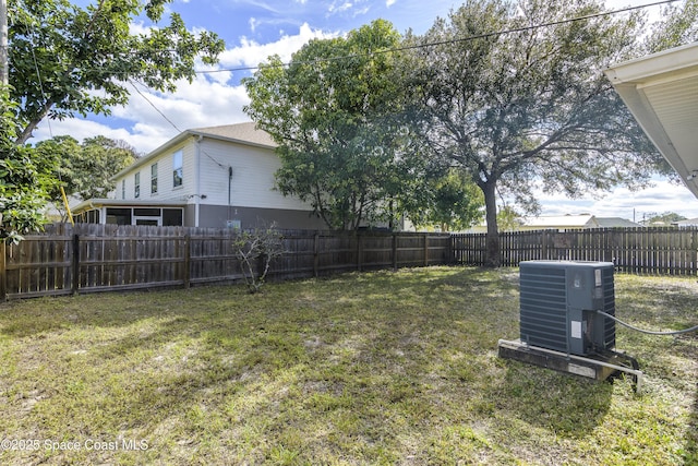 view of yard featuring central AC