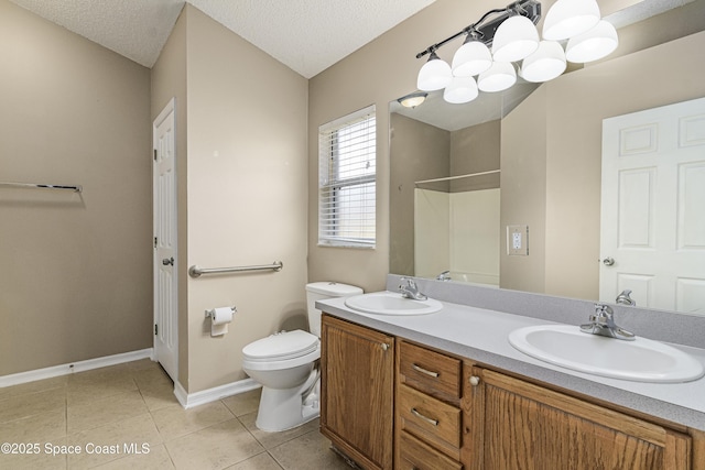 bathroom with a shower, tile patterned flooring, vanity, toilet, and a textured ceiling