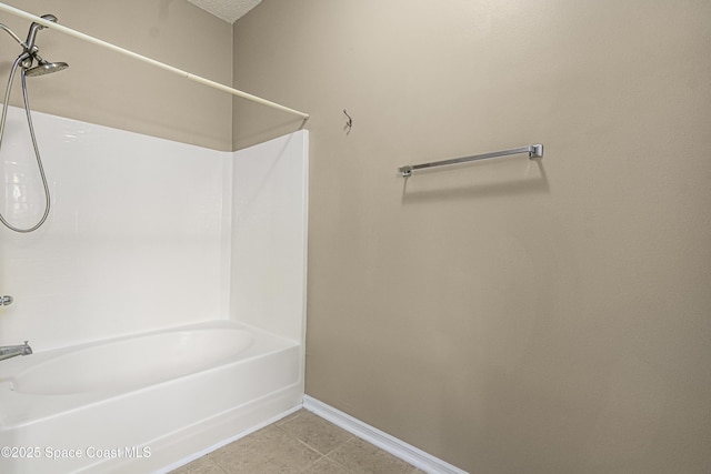 bathroom featuring tile patterned flooring and bathtub / shower combination