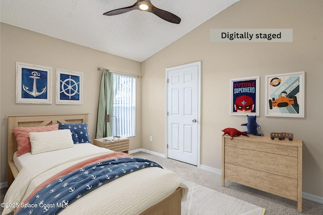 bedroom featuring lofted ceiling, ceiling fan, light colored carpet, and a textured ceiling