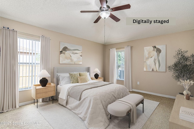 carpeted bedroom featuring ceiling fan, lofted ceiling, and a textured ceiling