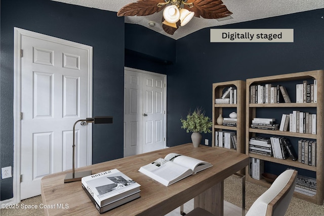 home office with ceiling fan, lofted ceiling, and a textured ceiling