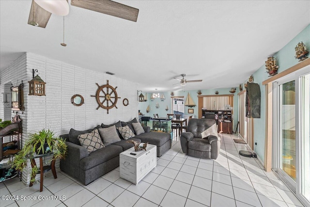 tiled living room featuring ceiling fan