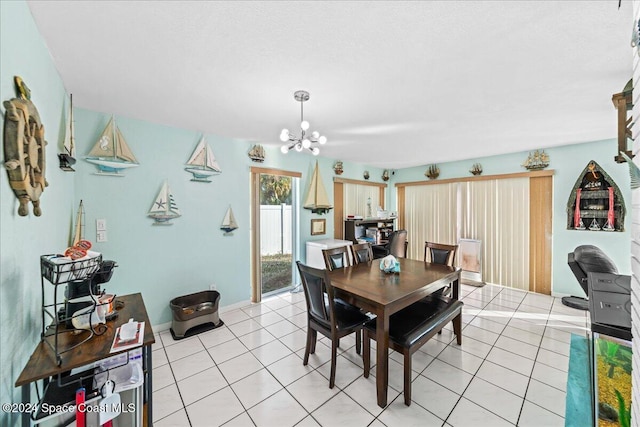 tiled dining area featuring a notable chandelier