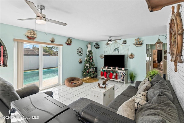 living room featuring ceiling fan and light tile patterned floors