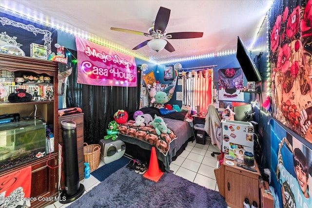 bedroom featuring light tile patterned floors and ceiling fan