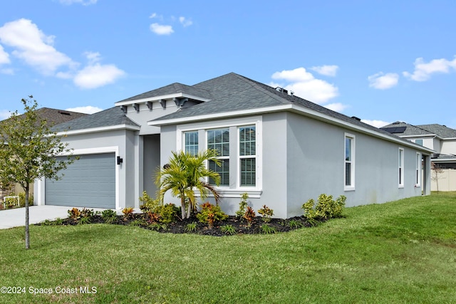 front facade with a garage and a front yard