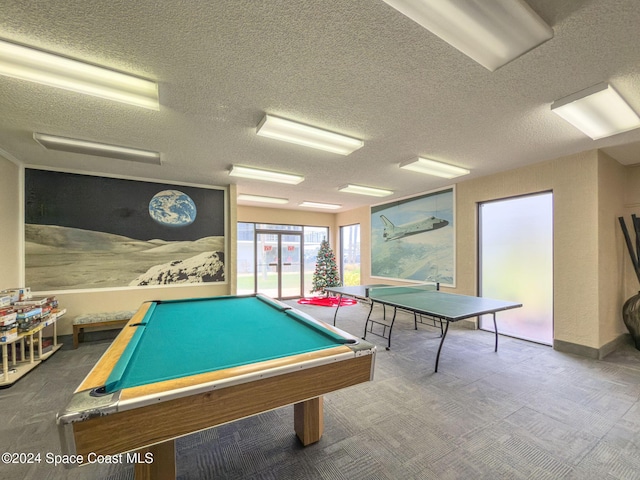 recreation room featuring carpet floors, a textured ceiling, and pool table