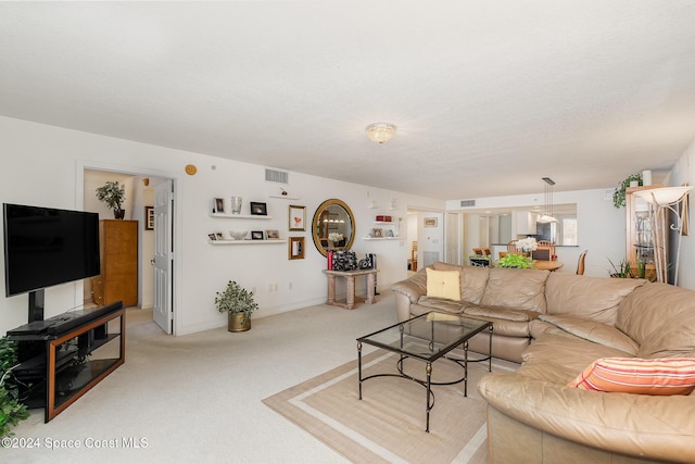 living room featuring light carpet