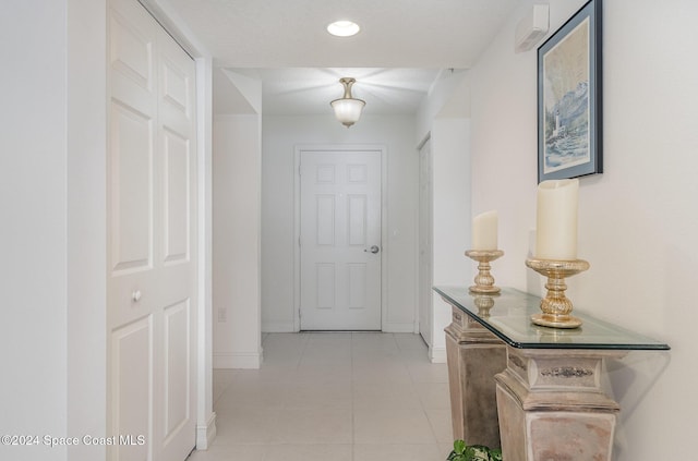 corridor with light tile patterned flooring