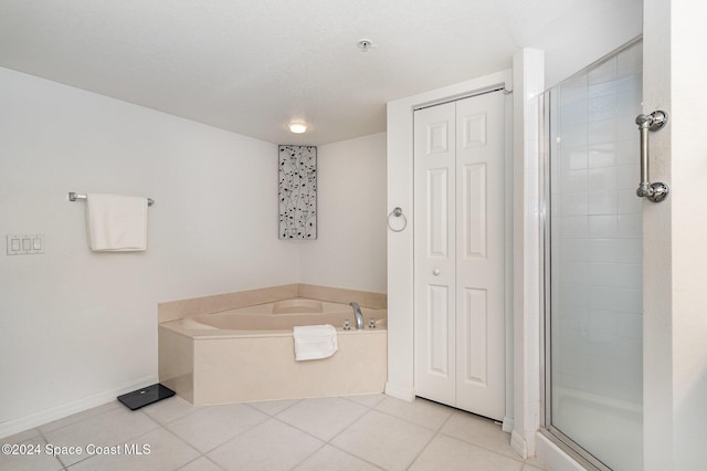 bathroom featuring tile patterned floors and plus walk in shower