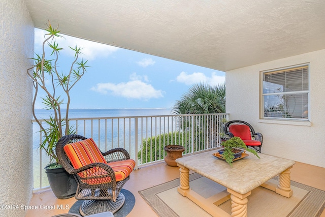 balcony featuring a water view