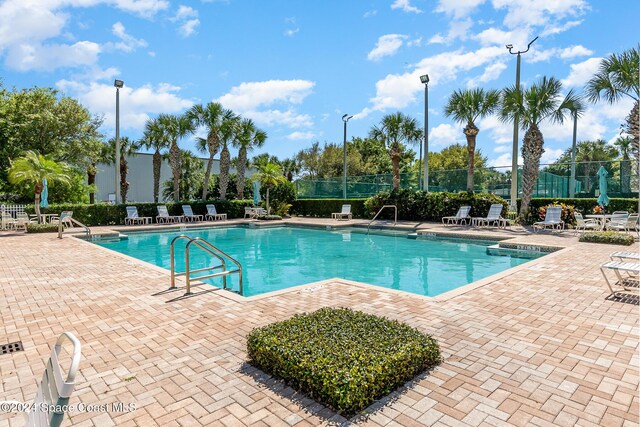 view of swimming pool with a patio area