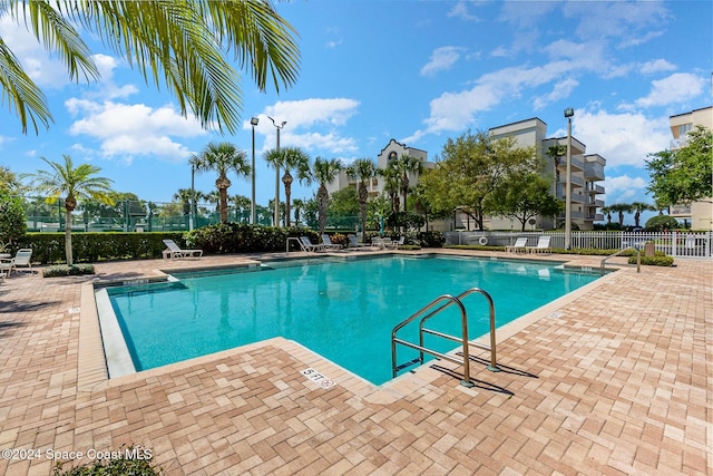 view of swimming pool featuring a patio area