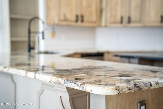 details with kitchen peninsula and light brown cabinets