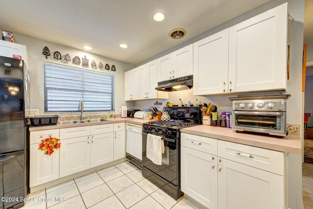 kitchen featuring black gas range, white cabinetry, sink, and white dishwasher