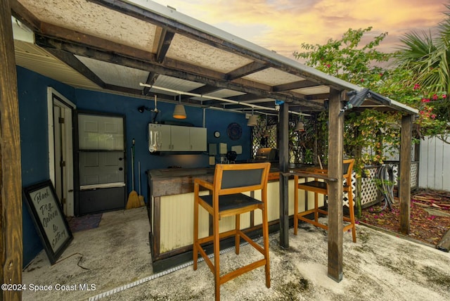 patio terrace at dusk with an outdoor bar