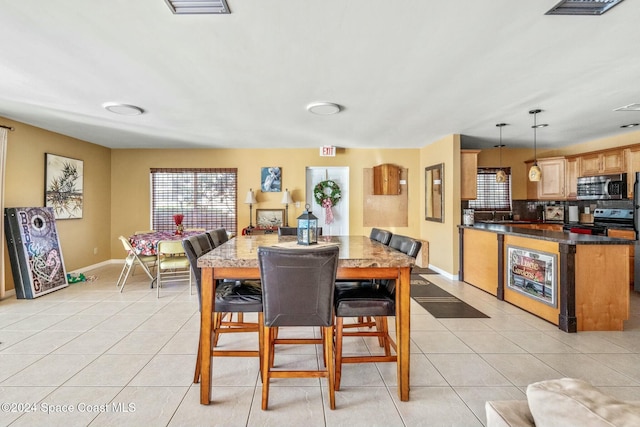 dining room with light tile patterned flooring