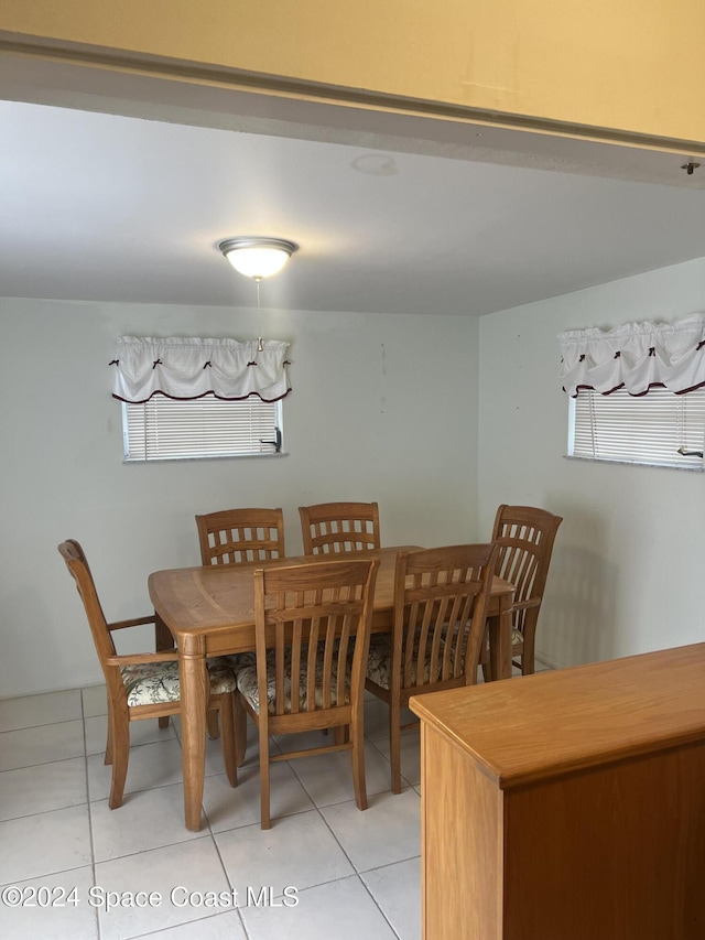 dining space with light tile patterned floors