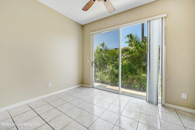 empty room featuring ceiling fan and light tile patterned floors