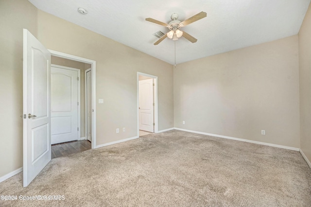 unfurnished bedroom featuring ceiling fan and light colored carpet