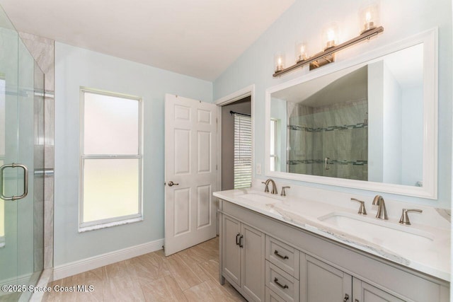 bathroom featuring vanity and a shower with shower door