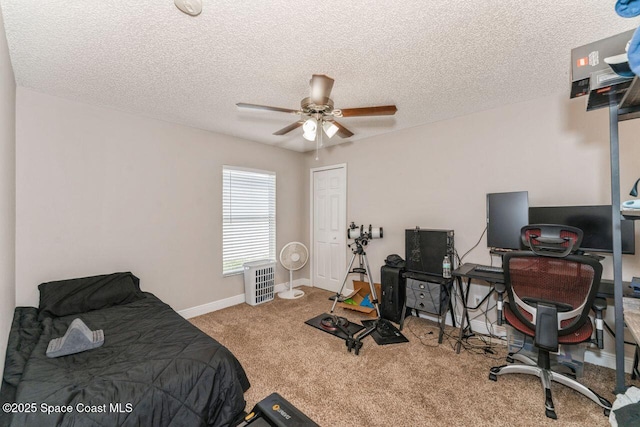 bedroom with ceiling fan, carpet floors, a textured ceiling, and a closet