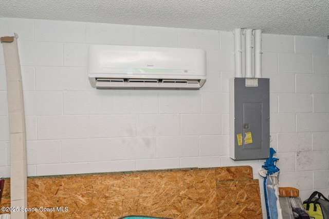 room details with a textured ceiling, electric panel, and a wall unit AC