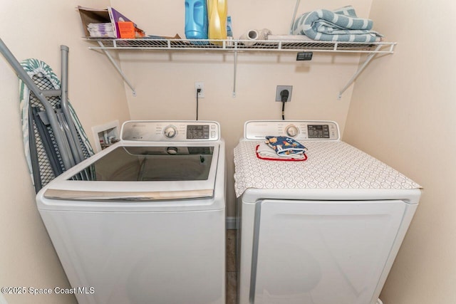 laundry room with separate washer and dryer