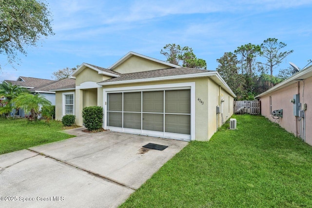 view of front facade with a garage and a front lawn