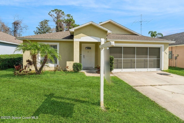 single story home featuring a garage and a front lawn