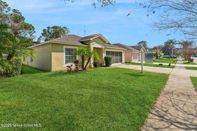 ranch-style house with a garage and a front yard