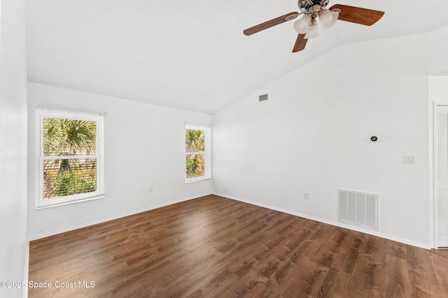 spare room featuring ceiling fan, dark hardwood / wood-style floors, and lofted ceiling