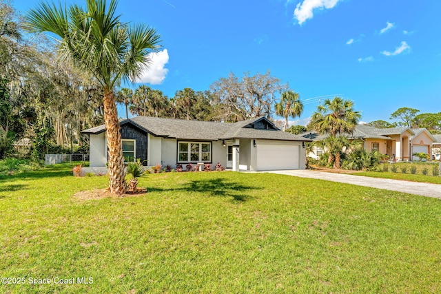 single story home featuring a garage and a front yard