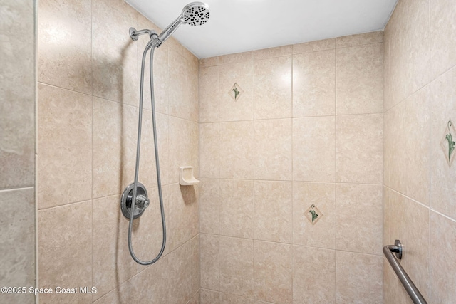 bathroom with tiled shower