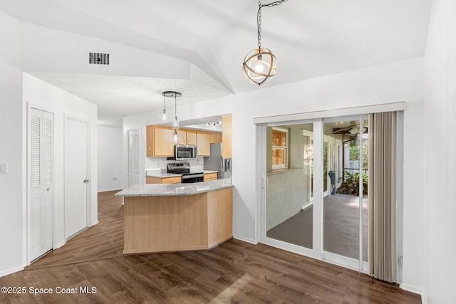 kitchen featuring dark hardwood / wood-style floors, appliances with stainless steel finishes, pendant lighting, and light brown cabinets