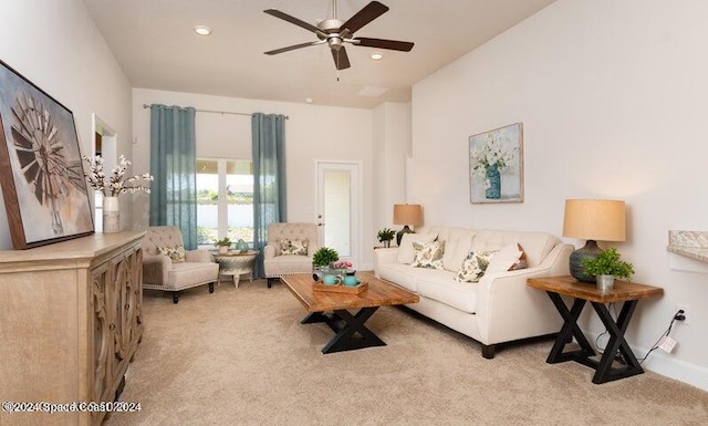 living room with light carpet and ceiling fan