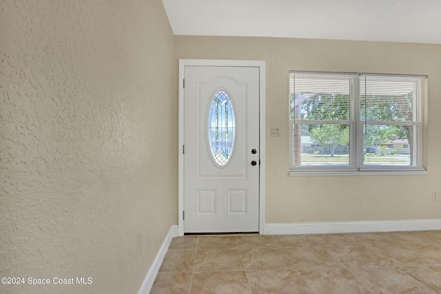 entryway featuring light tile patterned floors