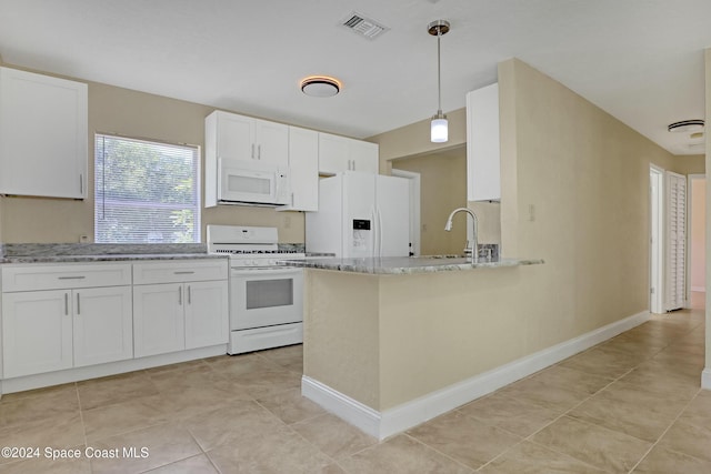 kitchen with white cabinets, pendant lighting, white appliances, and light stone countertops