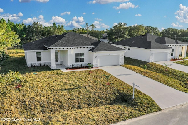 view of front of house with a garage and a front yard