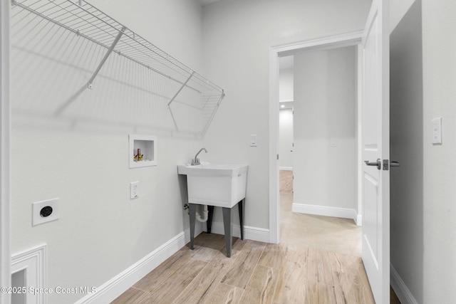 clothes washing area with hookup for a washing machine and electric dryer hookup