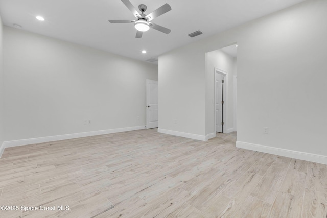 unfurnished room with ceiling fan and light wood-type flooring